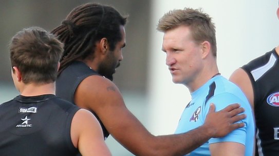 Heritier Lumumba (right), then Harry O’Brien, with Nathan Buckley in 2013.