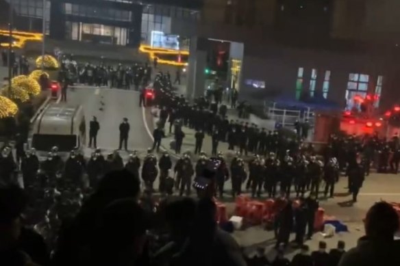 Police outside the factory in the city of Chongqing in south-western China.