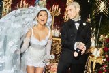 Kourtney Kardashian and Travis Barker wearing Dolce & Gabbana at their Italian wedding.
