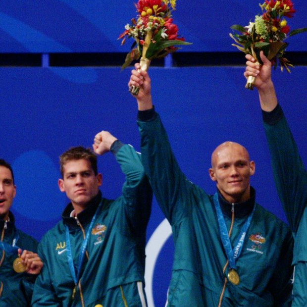 Bill Kirby, Todd Pearson, Michael Klim and Ian Thorpe celebrate another gold medal and another world record in the Sydney pool.
