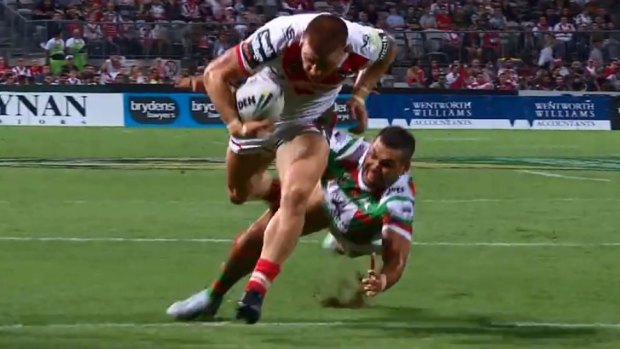 Shown up: Euan Aitken leaves Greg Inglis in his wake on his way to score in round 5.