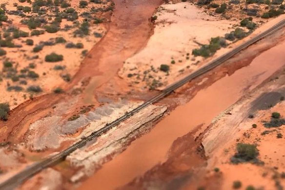 Floods have severely damaged the east-west rail link, stopping trains carrying goods and commodities from Adelaide to Perth and Darwin.