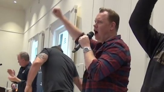 Victorian Trades Hall secretary Luke Halikari leads a chant of 'John Setka here to stay'.