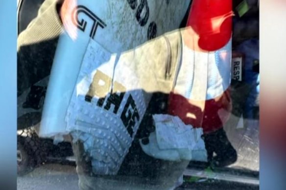 The surfboard in the back of an emergency vehicle at Port Macquarie on Tuesday.