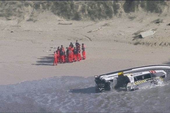 The Marine Rescue boat BA30 washed up on the beach at South Ballina.