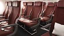 The 140-seat Economy cabin, configured in a 3-3-3. The woven wool upholstery is in an earthy Australian 'Pilbara Red’ colour. More than 70 per cent of seats on the aircraft will offer a pitch of 33 inches or more, the most generous of any Qantas aircraft.