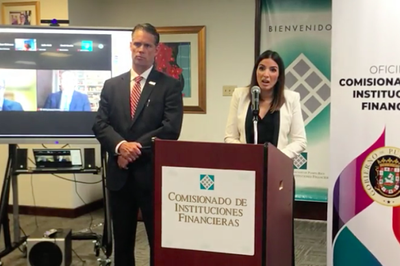 US Internal Revenue Service criminal investigation chief Jim Lee and Office of the Commissioner of Financial Institutions of Puerto Rico commissioner Natalia Zequeira Diaz during the announcement on Friday.
