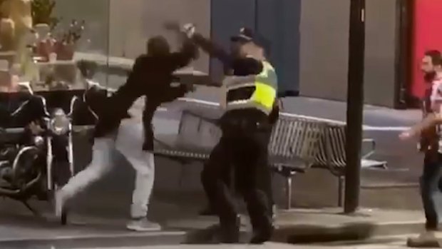Police confronting Bourke Street attacker Hassan Khalif Shire Ali during this month's Bourke Street attack.