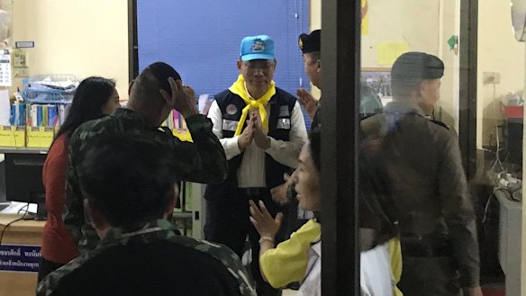 Rescue mission chief Narongsak Osottanakorn puts his hands together in the common Thai gesture of greeting and thanks. 