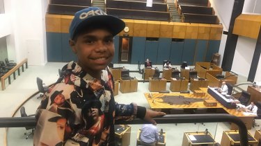 Dujuan listens on as his speech is read in Northern Territory Parliament.