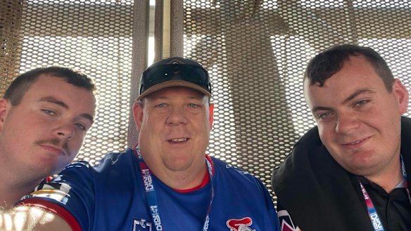 Chris Clancy (centre) was among the Knights supporters hit by a car in Newcastle on Saturday morning. 