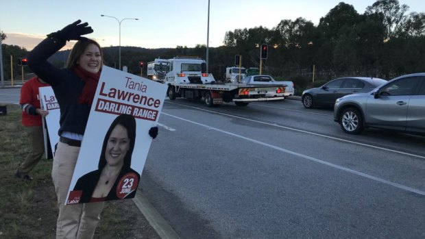 Labor Darling Range candidate Tania Lawrence braves the cold on Friday morning to campaign.