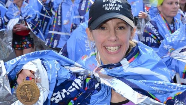 Fundraising champion Sophie Smith crosses the finish line in the New York Marathon, 2016.