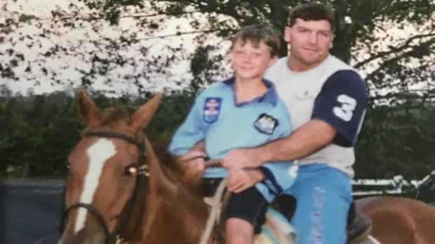 Boy in blue: Damien Cook with his uncle Peter Phillips.