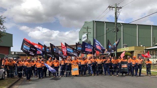 Workers strike outside Downer's Maryborough factory, which is where the WA government's Forrestfield link trains are being built.