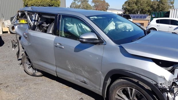 The wreck of the car in the harsh daylight. Banks man Lachlan Wilson had borrowed the car from his boss to take his family to Sydney. Another driver was arrested and charged with drink driving following the accident.