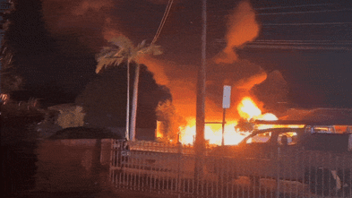 Fire torches front yard of home north of Brisbane