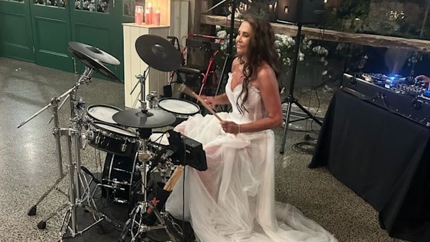 Stonnington Mayor Melina Sehr playing a drum medley at her wedding on Saturday.