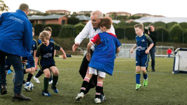 Scott Morrison trips into child on the field whilst playing soccer at the  Davenport Strikers Soccer Club in the seat of Braddon.