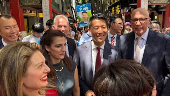 Xiongming Xie joins supporters with Scott Yung and Peter Dutton in Sydney on Sunday. 