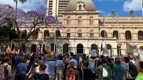 Demonstrators rally outside Parliament in Brisbane to rail against Queensland's proposed anti-protest laws.