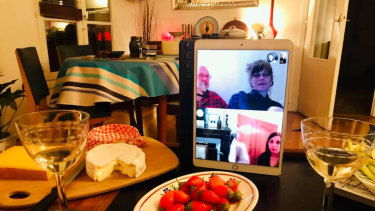 Peter O'Shea and Andy Prior (top left on iPad screen) joined friends over a cheese and wine soiree while on lockdown. "It was so much fun," Prior said.