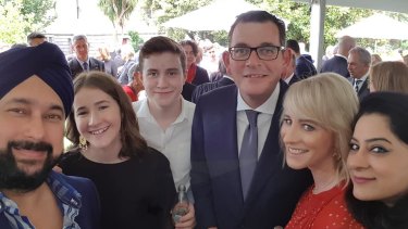 Daniel Andrews and his wife Cath with Luckee Kohli (left) at Parliament House in 2018. 
