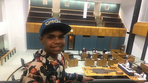 Dujuan Hoosen listens on as his speech is read in Northern Territory Parliament.