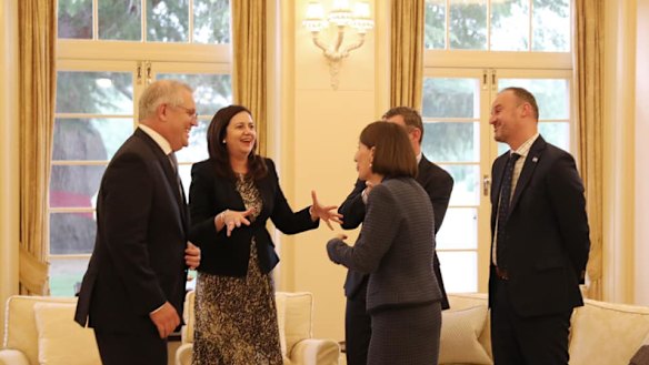 National cabinet members share a moment of levity in December 2020. 