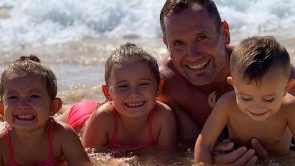 Rowan Baxter with his children.