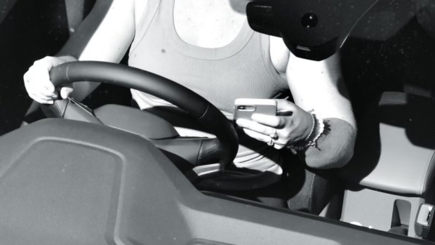 The cameras caught this distracted driver for not wearing a seatbelt and fiddling with their phone.