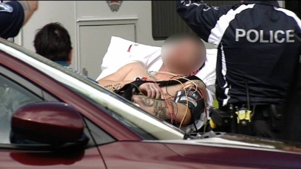 The man was taken to hospital for treatment of a broken arm before being released and charged.