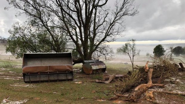 Coolabunia farmer Damien Tessmann is trying to repair the damage after thunderstorms and hail hit the area.