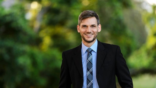 The Greens have named environmental lawyer Michael Berkman to run against state Environment Minister Steven Miles in their 'most winnable' seat.