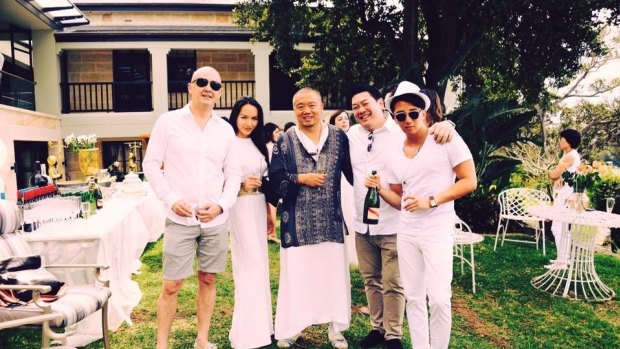 Kuizhang 'Sam' Guo (centre) at his White Party with guests including Sasha Chan (left) and Ryan Gollan (far right).