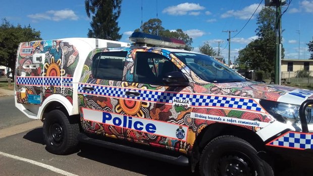 Queensland's Woorabinda Police Station has two vehicles with Indigenous artwork created with the help of local students.