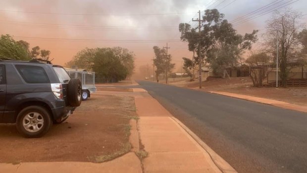 Dust sweeps through a street in the Pilbara town of Newman. 