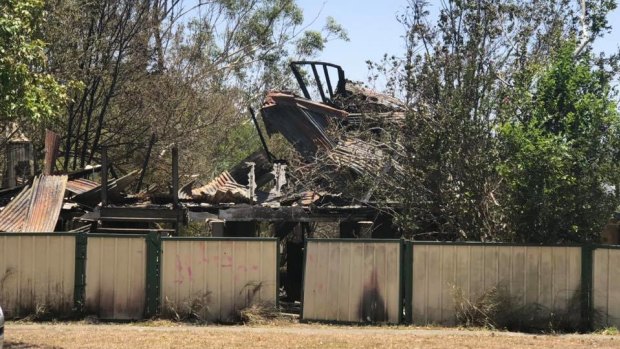 The fire destroyed the house on Woogaroo Street in Goodna and left a man in a serious but stable condition in hospital.