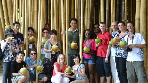 Karm Gilespie [in red] after raising funds for the Kul-Kul Scholarship Fund with Roger Hamilton to educate local Balinese children at the Green School in Bali. 