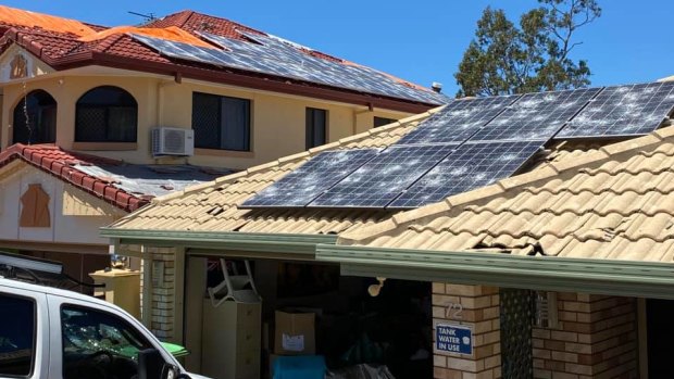 Queensland's storm has left roofs and cars damaged as well as residents without power.