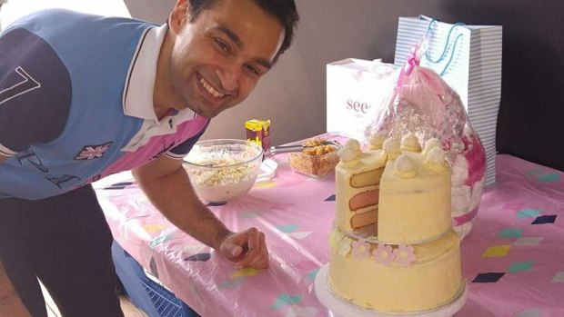 Ali Muzaffar and one of the multi-tier cakes he bakes in his spare time.