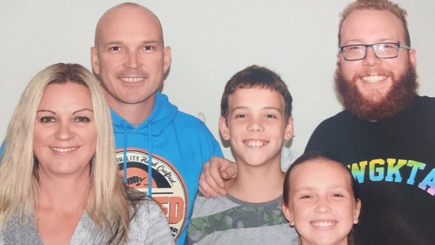 Scott Blanchard, left, in the blue top, with his three children and wife Justine.