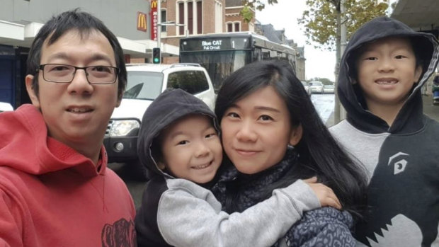 Edwin Tjandra, left, with his young family before the crash. 