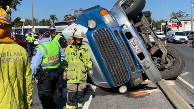 A truck rollover has caused the closure of a road at Woolloongabba as emergency services work to clear the scene.