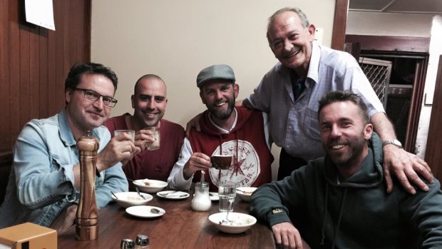 Photographers (from left) Vince Caligiuri, Chris Hyde, Darrian Traynor and Quinn Rooney pose with Sisto Malaspina.