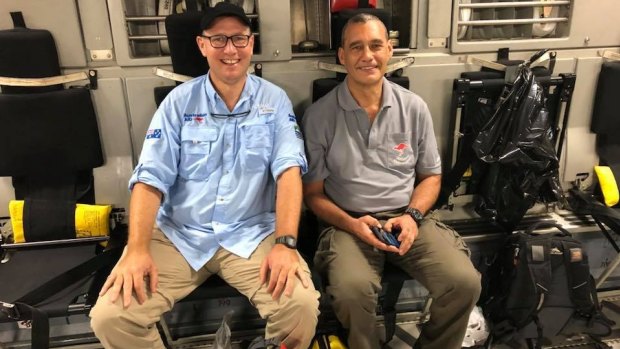 Richard Harris (left) and Craig Challen on their way back to Australia on an RAAF transport following the successful rescue mission. Their lives have been transformed.