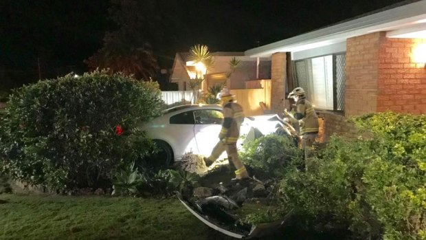 The Mooloolaba home was extensively damaged, according to police, after the car smashed into the front room.