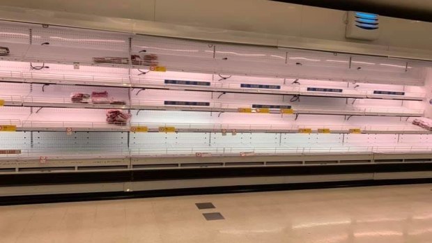 Empty supermarket shelves at Coles in Karratha as residents prepare for the Cyclone Damien. 