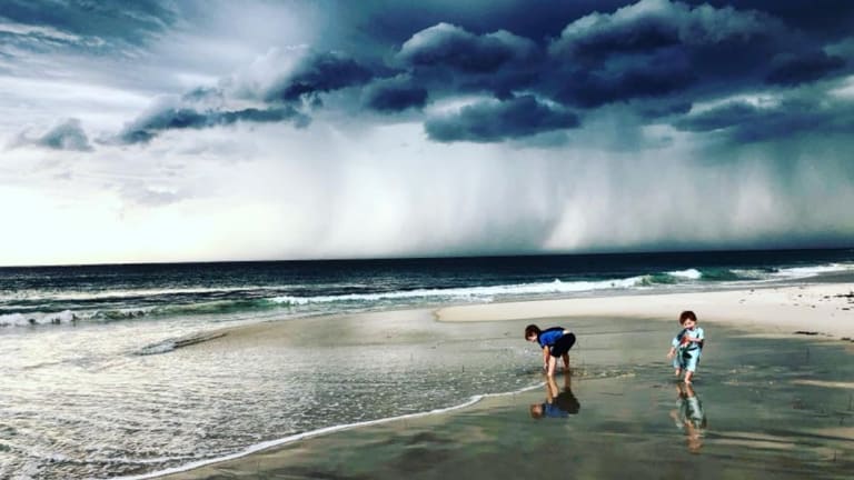 An ominous backdrop for an afternoon at the beach.