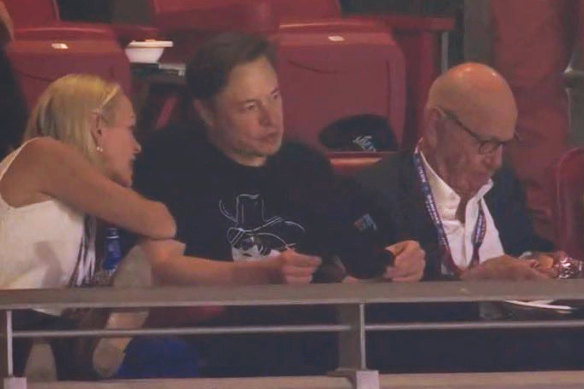 Elon Musk, centre, with Elisabeth and Rupert Murdoch at the Super Bowl.